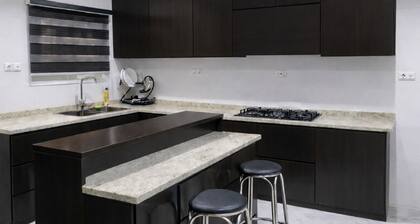 Luxury 4-bedroom house in a secure estate inside Abuja with power supply and AC