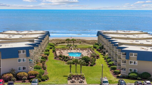 A beachfront hotel with a swimming pool, beach access, and ocean views. - The Tiki Hut- 2 Bed, 2 Bath Oceanview Shore Drive Condo (Myrtle Beach)