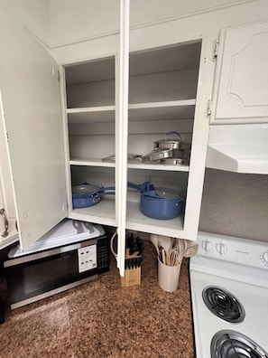 Fridge, microwave, stovetop, coffee/tea maker