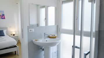 Double Room, Balcony, City View | Bathroom | Shower, hair dryer, towels, toilet paper