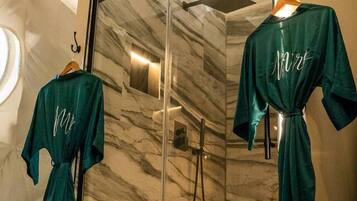 Shower, eco-friendly toiletries, towels, soap