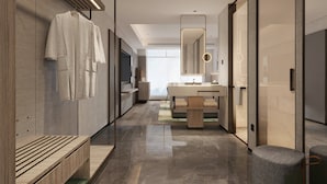A modern hotel bathroom with a vanity, mirror, and towel rack. - Holiday Inn Jinan Daming Lake By IHG (Jinan)