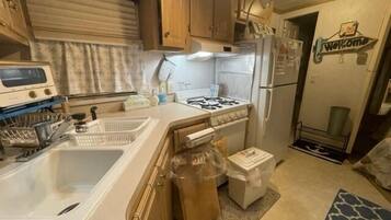 Fridge, microwave, stovetop, cookware/dishes/utensils