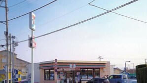 A 7-Eleven convenience store with a clear storefront and visible signage. - Maruhei Minshuku (Tateyama)
