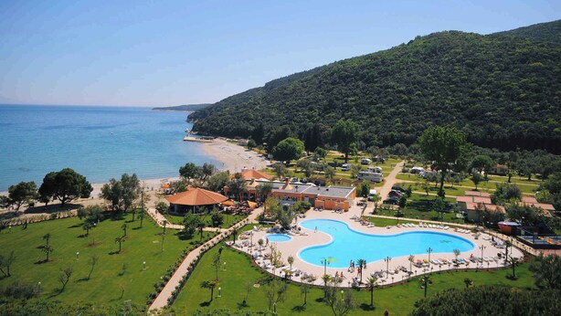 A resort with a large swimming pool, beach access, and lush greenery. - Holiday Home with Pool and Wi-Fi (Rabac)