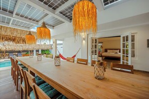 Outdoor dining - Bali-Inspired 7BR Private Oasis Walk to Palm Beach (Noord)