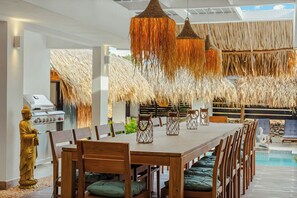 Outdoor dining - Bali-Inspired 7BR Private Oasis Walk to Palm Beach (Noord)