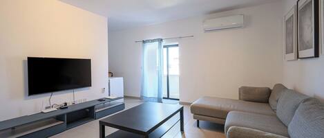 Apartamento, vistas a la ciudad | Zona de estar