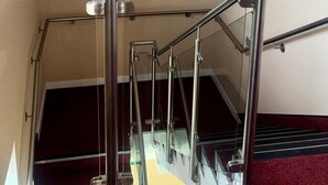 A metal staircase with handrails and a glass barrier. - Peaceful Urban Retreat in Wolverhampton City (Wolverhampton)