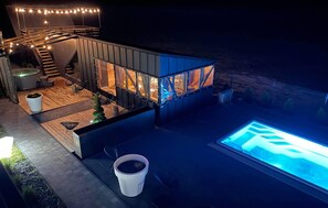 A modern outdoor patio area with a pool, seating, and a staircase leading to an upper level. - Gorgeous apartment in Ostrowo with sauna (Ostrowo)
