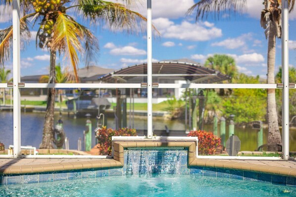 Outdoor pool, a heated pool - Spacious 4-bedroom, 2 Bathroom Gulf Access Pool Home. (Cape Coral)