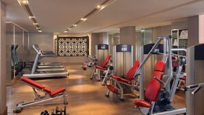 A modern gym with treadmills, weight machines, and free weights. - ITC Maurya, a Luxury Collection Hotel (New Delhi)