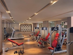 A modern gym with treadmills, weight machines, and free weights. - ITC Maurya, a Luxury Collection Hotel (New Delhi)