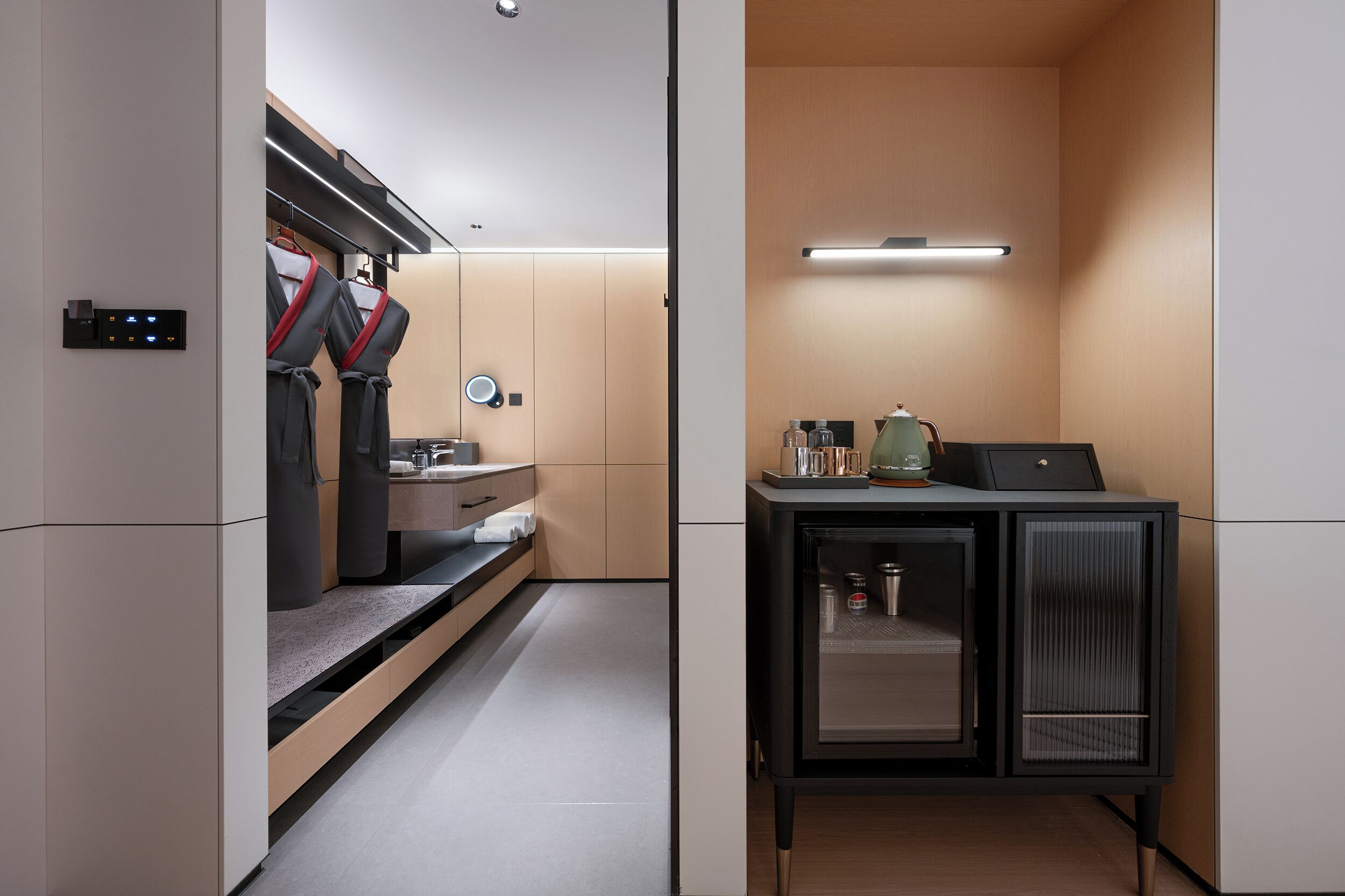 A modern bathroom with a shower, a sink, and a cabinet with toiletries.