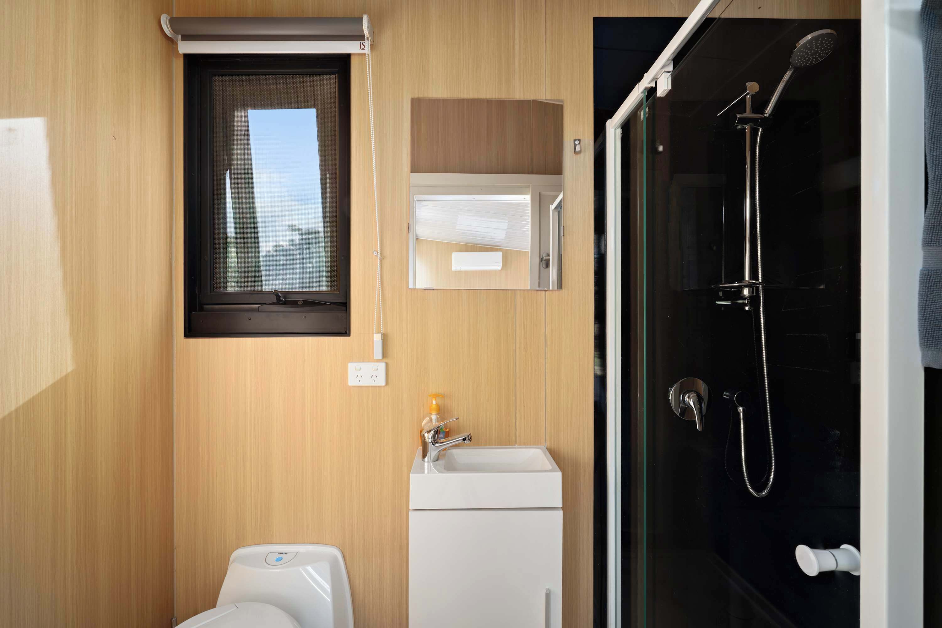 Shower, hair dryer, towels, shampoo