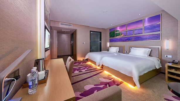 A hotel room with two beds, a desk with a chair, a TV, and a large window. - Lavande International Hotel Pazhou Convention & Exhibition Center Eastxiaonan Metro Station Branch - Free Deliver Service to Guangzhou Baiyun International Airport & Free Shuttle Bus to Canton Fair Complex During Canton Fair Period (Guangzhou)