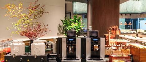 A coffee station with multiple coffee makers and a variety of coffee beans.