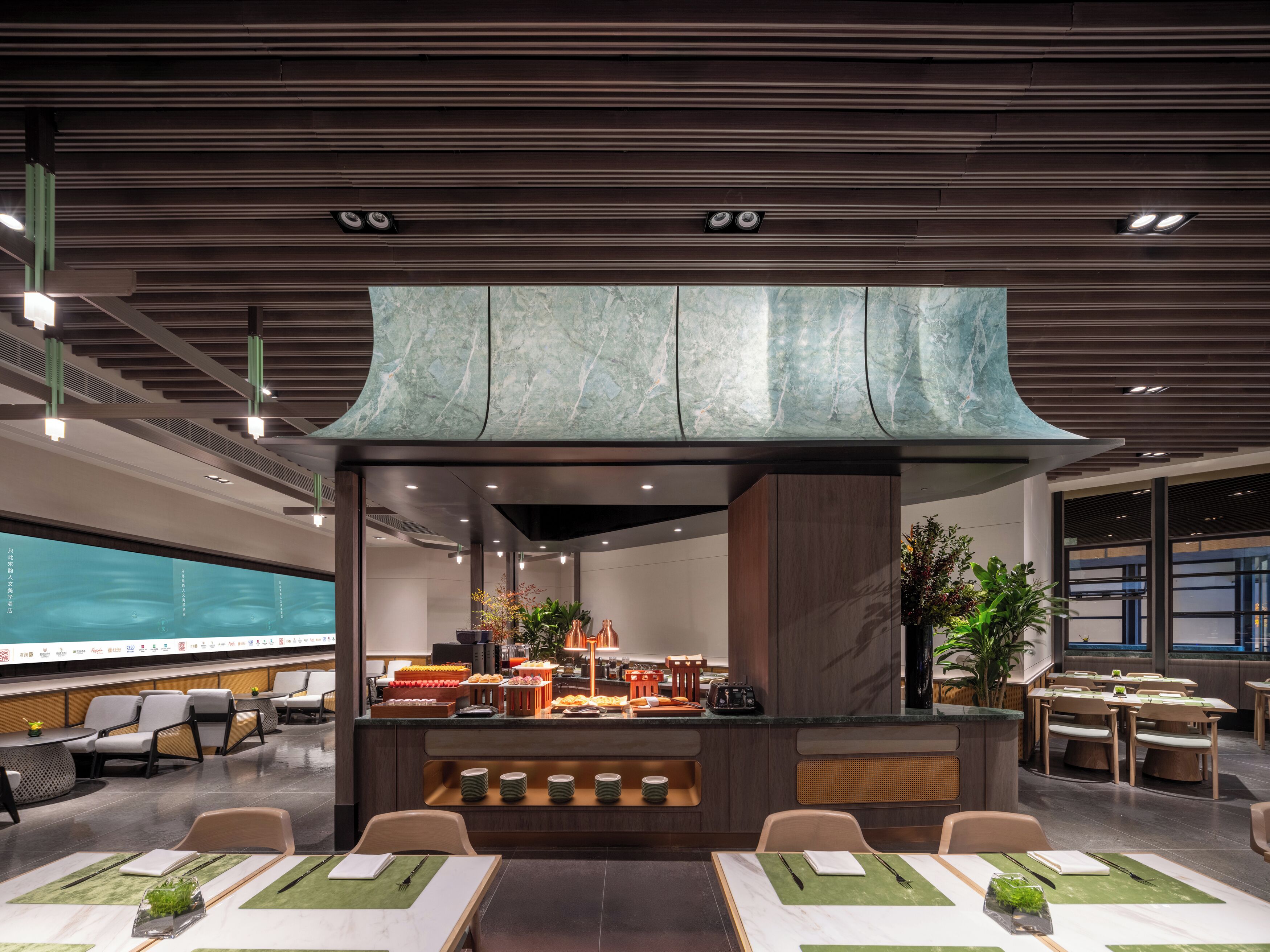 A modern dining area with a central buffet, seating arrangements, and a decorative ceiling.