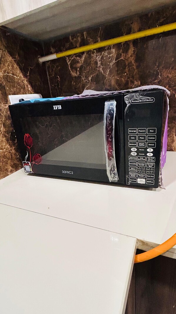 Appartement Deluxe, balcon, vue jardin | Micro-ondes