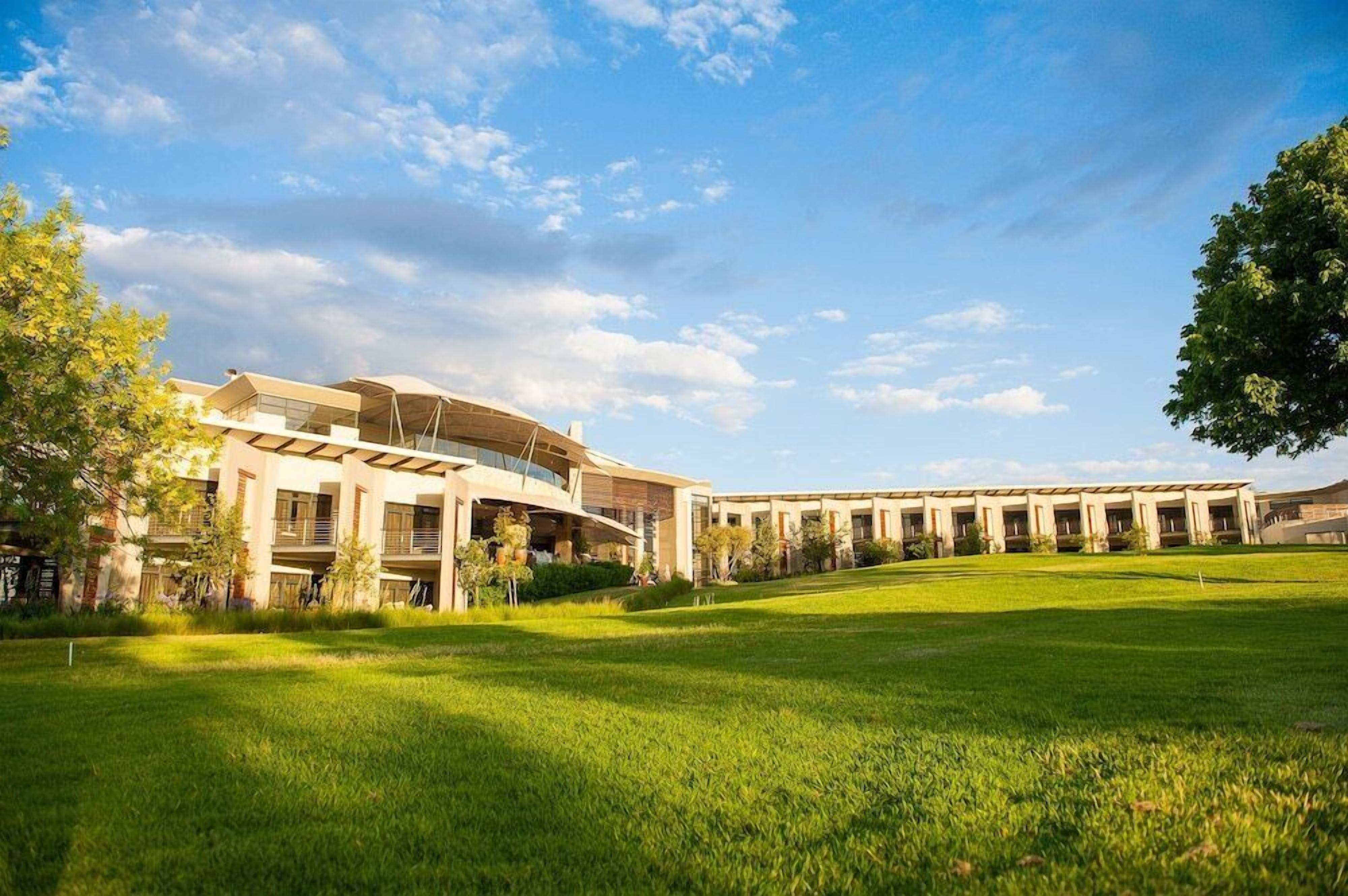 A modern building with a curved roof and a long corridor.
