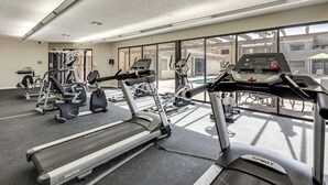 A gym with treadmills, ellipticals, and weight machines.