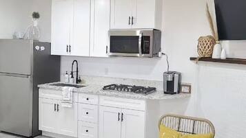 Fridge, microwave, stovetop, coffee/tea maker