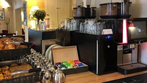 A buffet area with various food items, coffee machines, and tea dispensers. - Laugeval (Deauville)