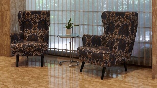 A room with two patterned armchairs, a small round table with a plant, and a large window with vertical blinds. - Regent Hotel Andheri (Mumbai)