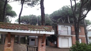 A building with a tiled roof, a brick entrance, and a sign reading "Villa Sandra". - Stylish Stay for 4 near Porto Caleri (Rosolina Mare RO)