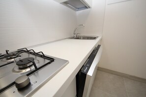 Microwave, stovetop, dishwasher, dining tables