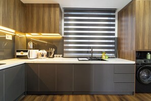 Deluxe Apartment, 2 Bedrooms | Private kitchen | Fridge, microwave, stovetop, rice cooker - Chill Hill Apartment (Co Giang)