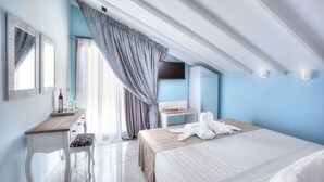 A modern hotel room with a bed, a bedside table, a mirror, a dresser, and a window with curtains. - Art Hotel (Kassandra)