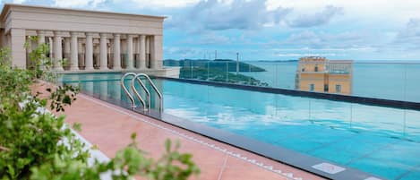 Outdoor pool, pool umbrellas, pool loungers