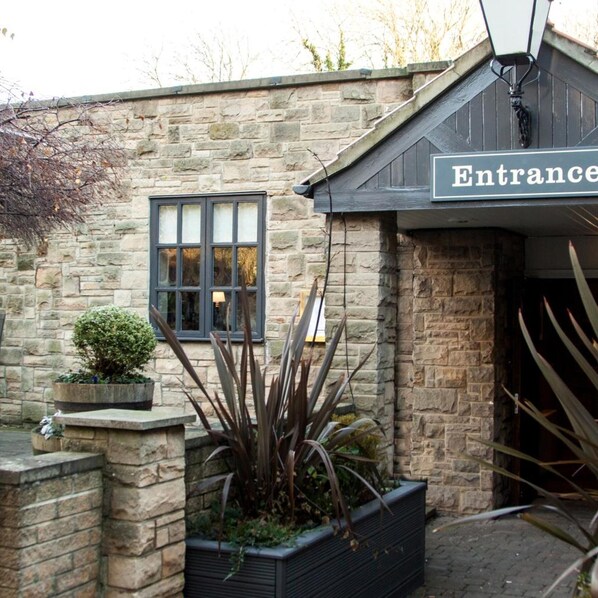 A stone building with a sign reading 'Entrance.' - Premier INN Middlesbrough South Guisborough (Guisborough)