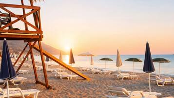 Private beach, white sand, beach umbrellas, beach volleyball