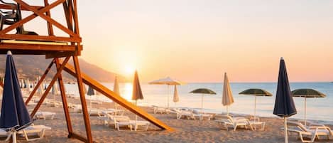 Private beach, white sand, beach umbrellas, beach volleyball