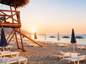 Private beach, white sand, beach umbrellas, beach volleyball