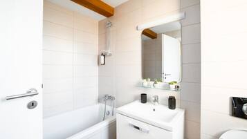 Shower, deep-soaking bathtub, hair dryer, towels