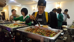 A buffet with various dishes, including rice, vegetables, and stir-fried meat. - Hotel Jojos (Nuwara Eliya)
