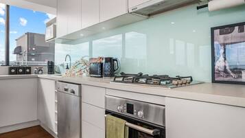 Coffee/tea maker, fridge, microwave, oven