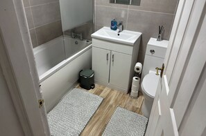 Combined shower/bathtub, deep-soaking bathtub, hair dryer, towels