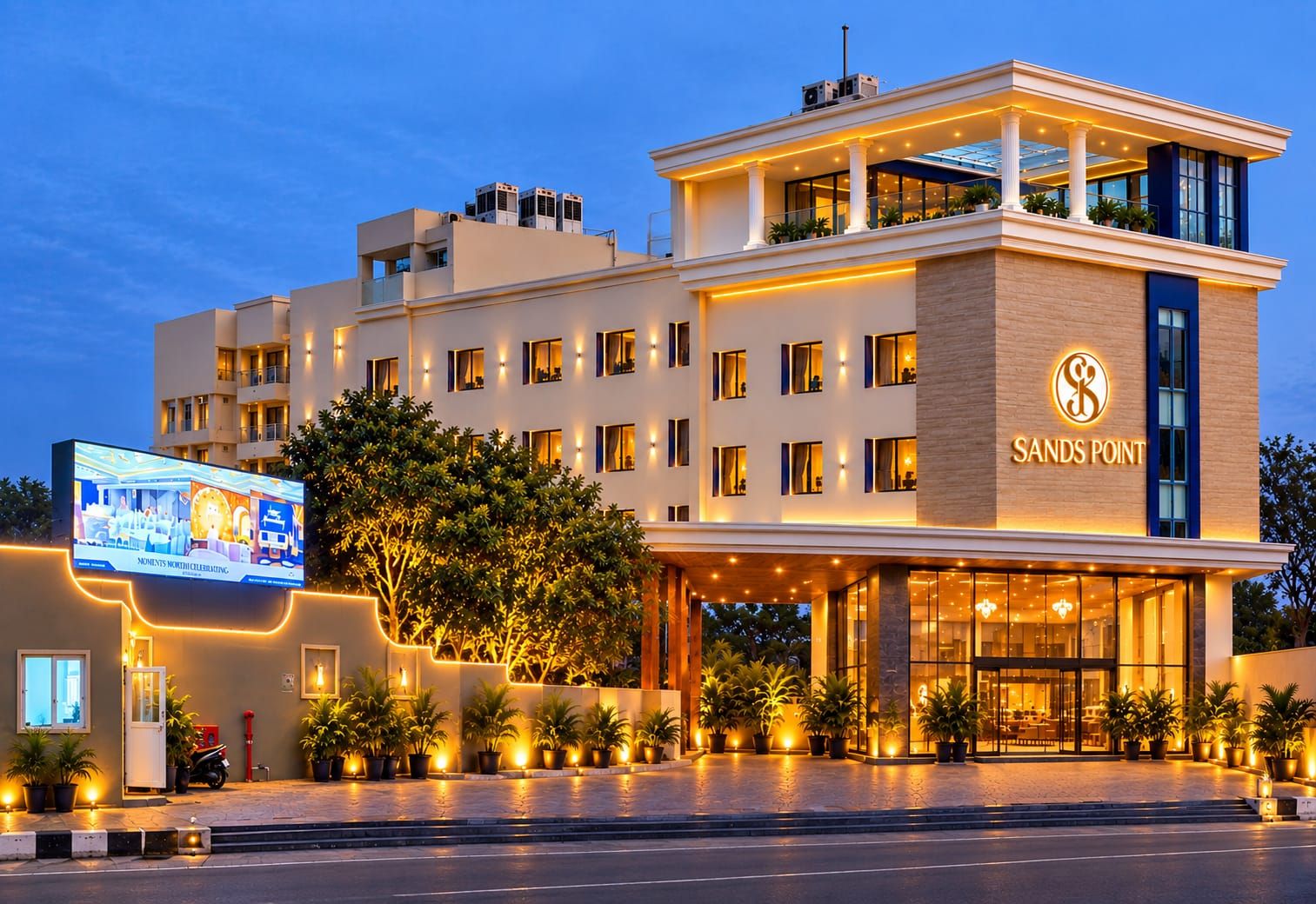 A hotel with a modern facade, a prominent logo, and a well-lit entrance.