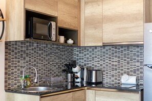 Apartment, Pool View | Private kitchen | Highchair