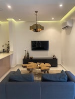 Family Apartment | Living area | 40-inch Smart TV with cable channels, Netflix, streaming services