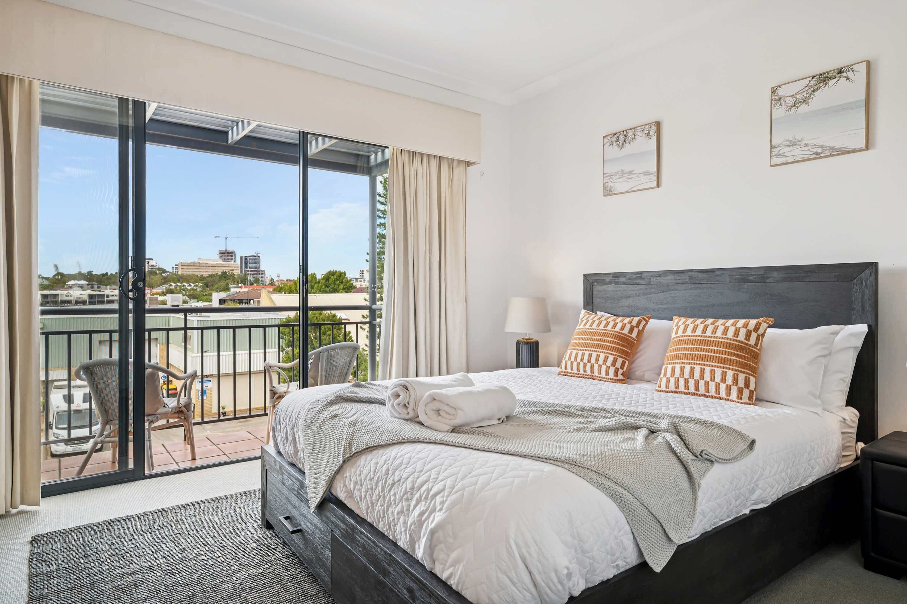 Bright, stylish bedroom with comfortable bedding to help you relax and unwind.