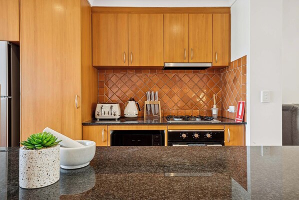 Coffee/tea maker, fridge, microwave, oven