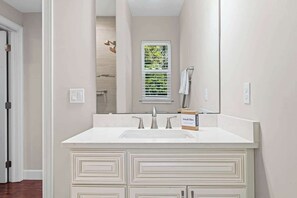 Shower, hair dryer, towels, shampoo