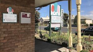 A building with a 'Self Check In' sign, a 'City Central Apartments' sign, and a 'Vacancies' sign. - City Central Motor Inn And Apartments (Warrnambool)