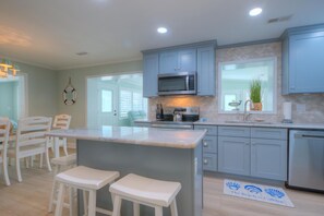 Fridge, microwave, oven, stovetop - Stay at The Lazy Sea Pony in Oak Island: 5BR, ocean view, private heated pool, sleeps 12. (Oak Island)