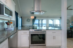 Fridge, microwave, oven, stovetop - Experience coastal bliss at Just Beachy, a 4-bedroom oceanfront retreat in Oak Island. (Oak Island)